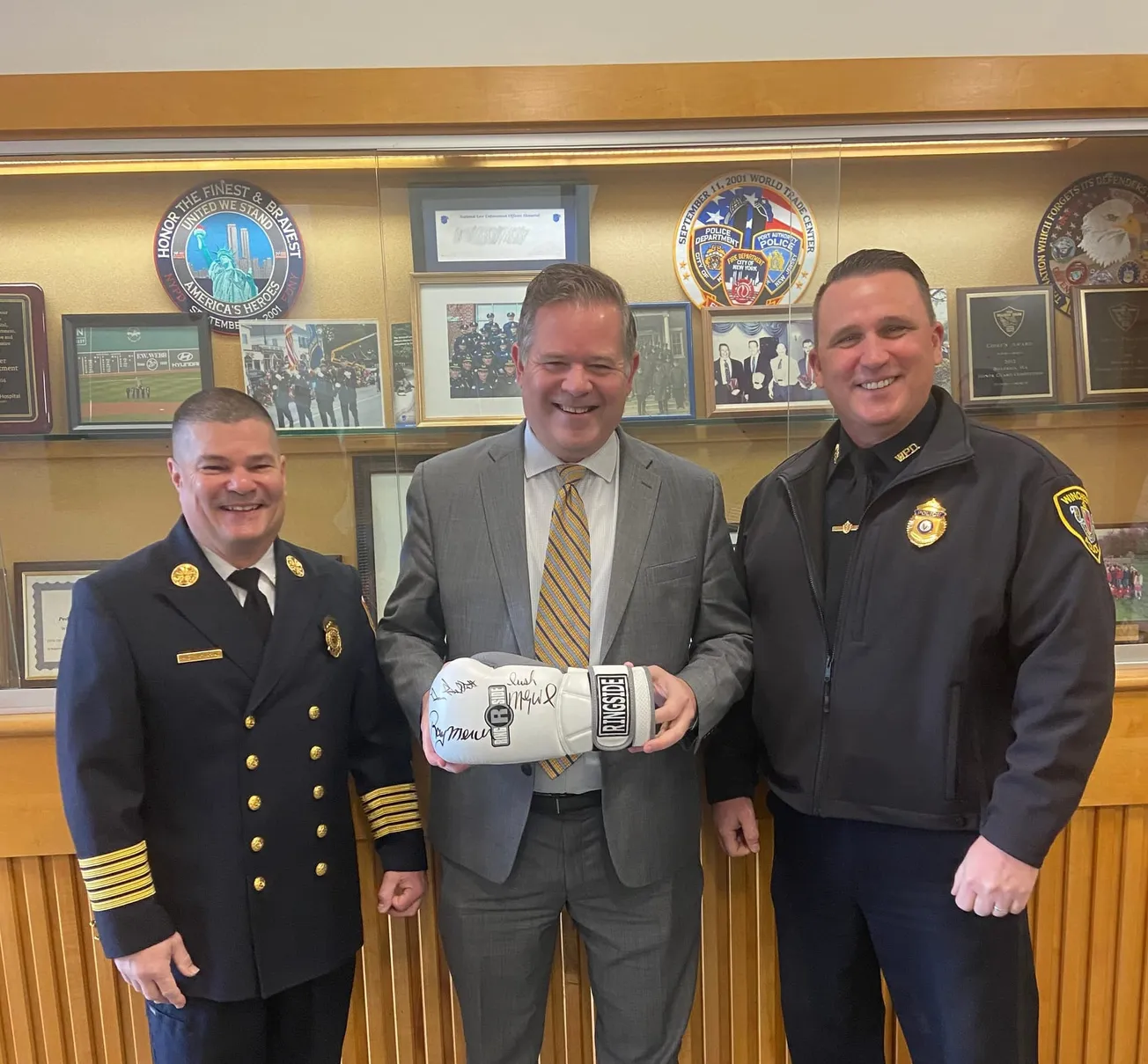 Rep. Michael Day donates boxing glove to Winchester police, fire departments