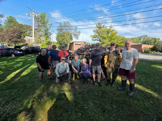 Winchester volunteers clear debris blocking Wedge Pond water flow
